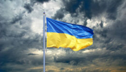 Ukraine flag. Ukrainian flag on black storm cloud sky. stormy weather